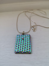 Load image into Gallery viewer, Rainbow dimpled dichroic glass pendant with handmade silver fittings &amp; silver snake chain
