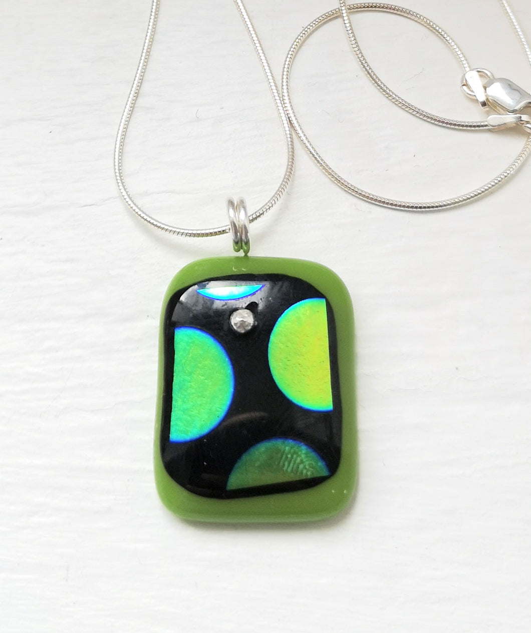 Green Polkadot Dichroic glass pendant with handmade silver fittings & silver snake chain